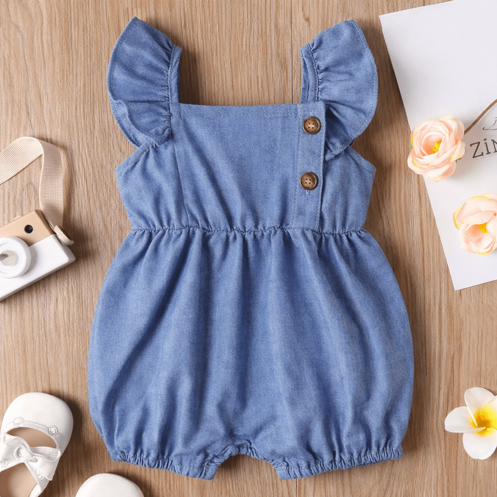 baby romper flat lay with accessories